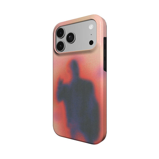 Angled view of the Umbra case showing the soft peach glow and shadow figure wrapping the side