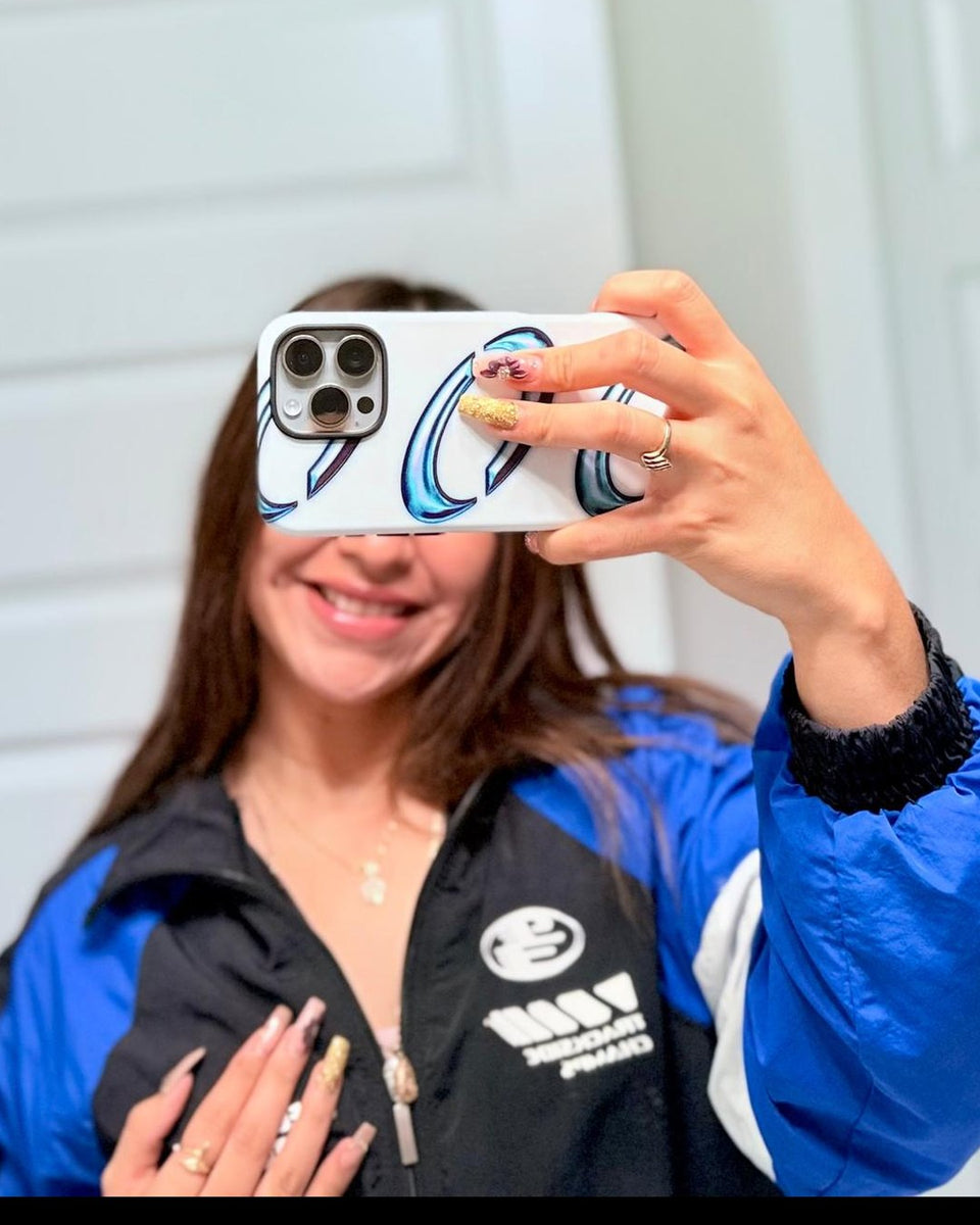 Mirror selfie with an iPhone in the Orbis case, white with chrome crescents